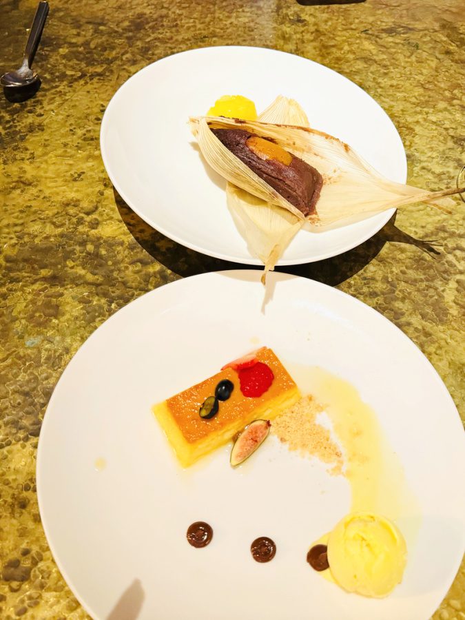 Two plates of gourmet desserts from Impression Moxché Dos Almas restaurant.
