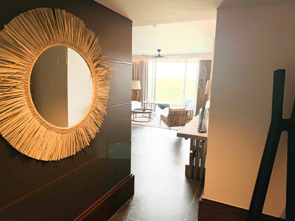 Photo showing the foyer of the guest suite, looking into the rest of the living area at the all-inclusive Impression Moxché resort in Playa Del Carmen, Mexico.
